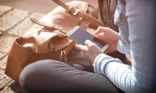 woman looking at phone